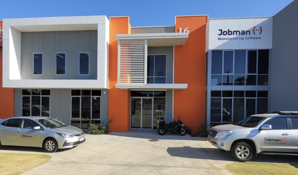 A front on view of the Jobman offices, with two cars parked in the carpark